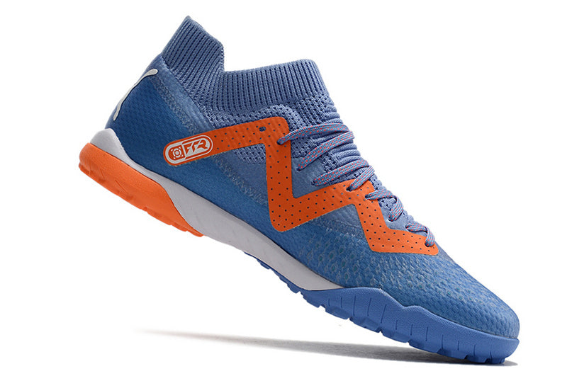 CHUTEIRA PUMA FUTURE ULTIMATE SOCIETY "SUPERCHARGE" - ROXA E LARANJA